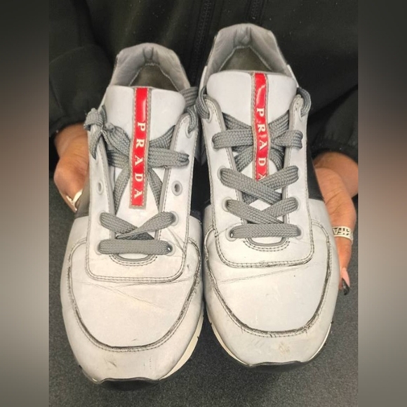 Prada White Leather Sneakers with Gray Laces and Red Logo Strip